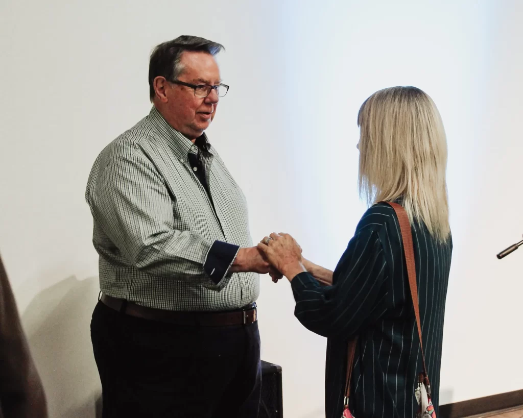 Man and woman shaking hands